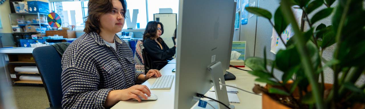 Sam working on designing a poster for the Spring Concert